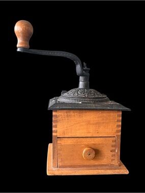 Antique manual coffee grinder w/ornate cast iron top and dovetailed wooden base